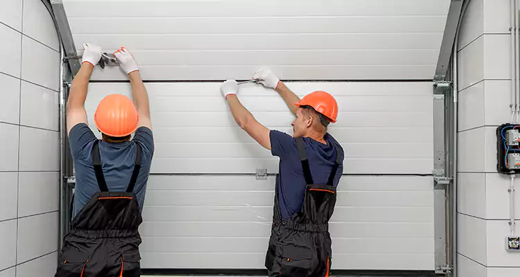 Garage Door Bottom Panel Repair in Hunters Creek, FL